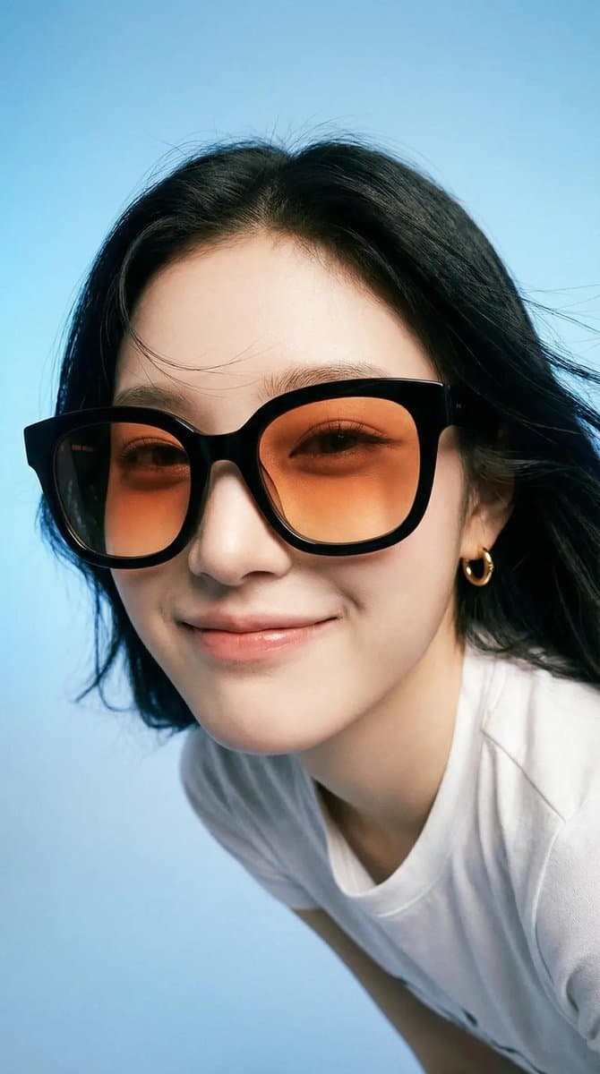 Photorealistic editorial portrait of a smiling woman usin...